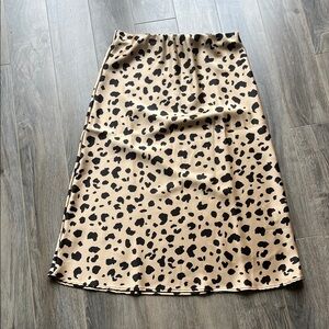 Renee C. Tan and Black Animal Print Midi Skirt